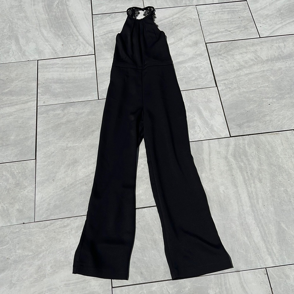 NWT. Holiday - Jumpsuit. Lace and Crepe material jumpsuit.
